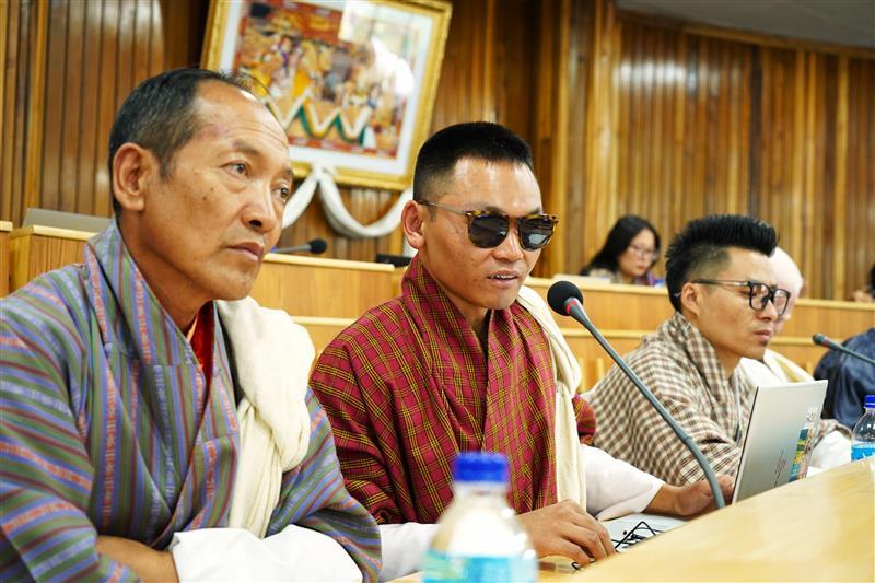 Participants at the UN Bhutan consultation on Leaving No One Behind (LNOB), including a representative with blindness (center), share their lived experiences and perspectives to inform inclusive development efforts.