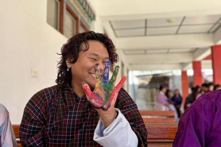 Colour, creativity, and smiles from youth advocate Sangay Loday at the SDG Festival. 
